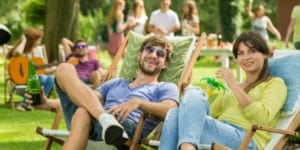 Couple relaxing at an outdoor barbecue party