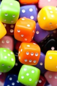 Multicolored dice randomly tossed in a pile