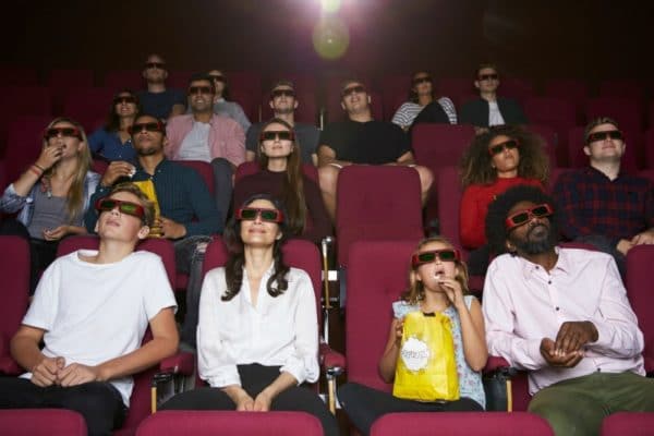 Audience In Cinema Wearing 3D Glasses Watching Film